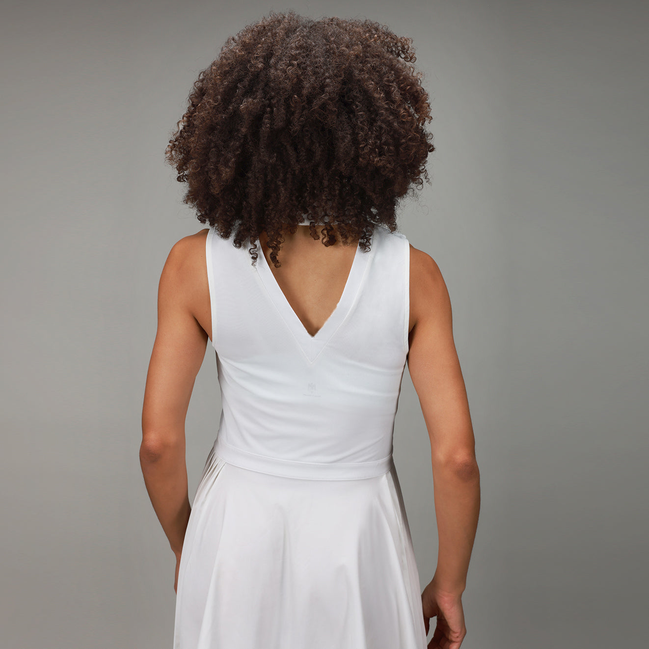 back of white triangle dress