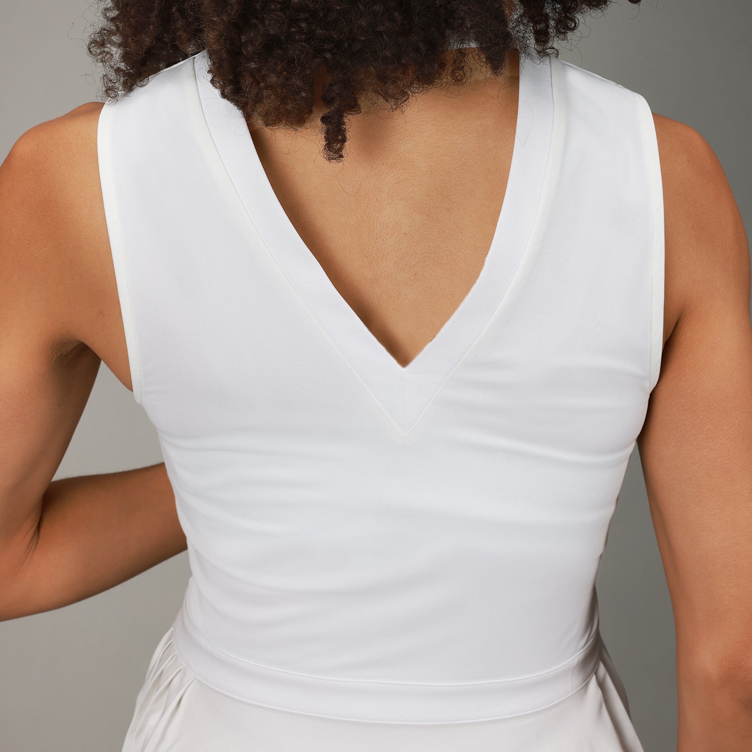 back close up of white triangle dress