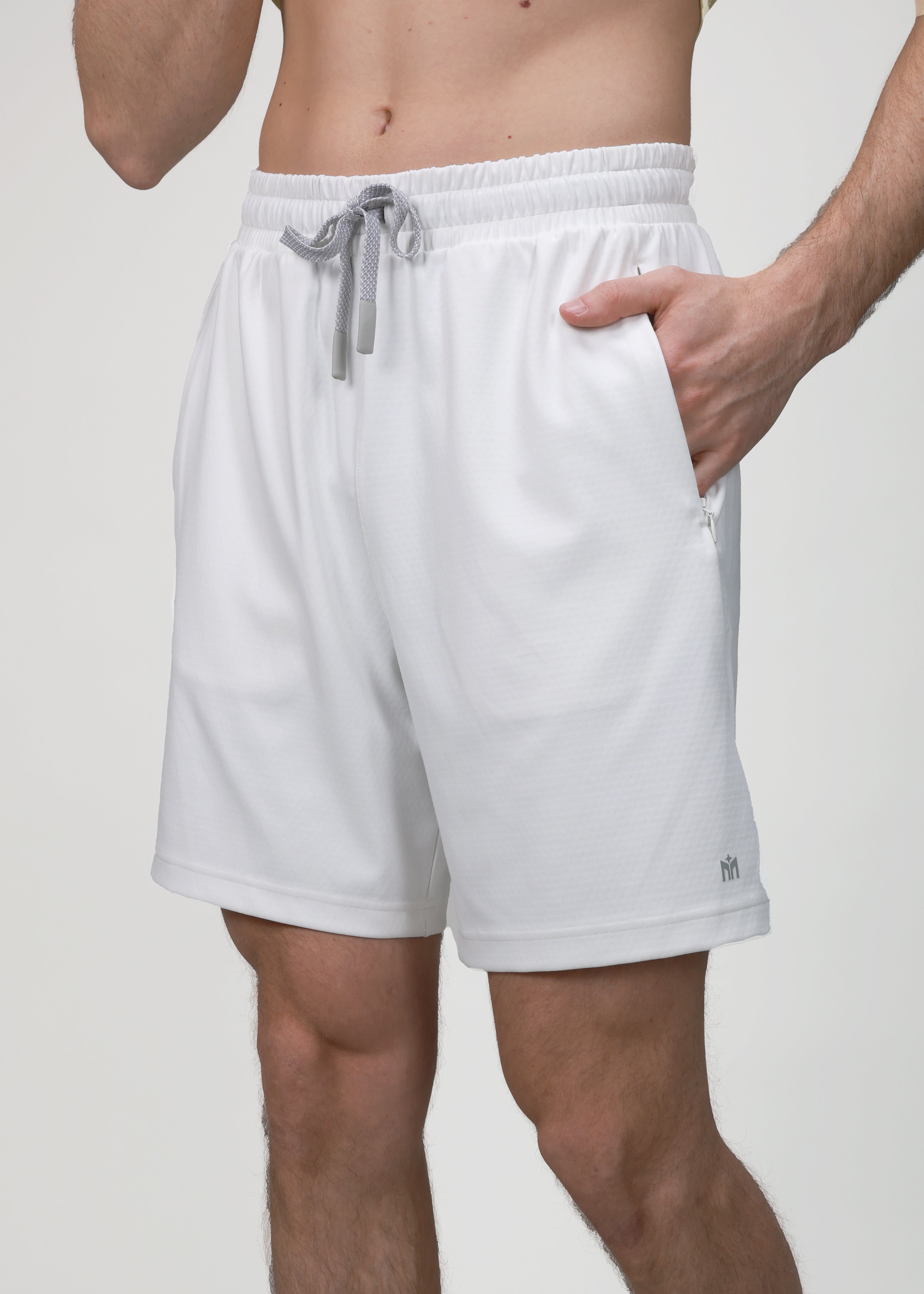 White shorts with a gray drawstring on a plain background