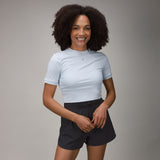 front of black tulip short and light blue crop tee