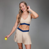 front of khaki pleated skirt and khaki tanklette