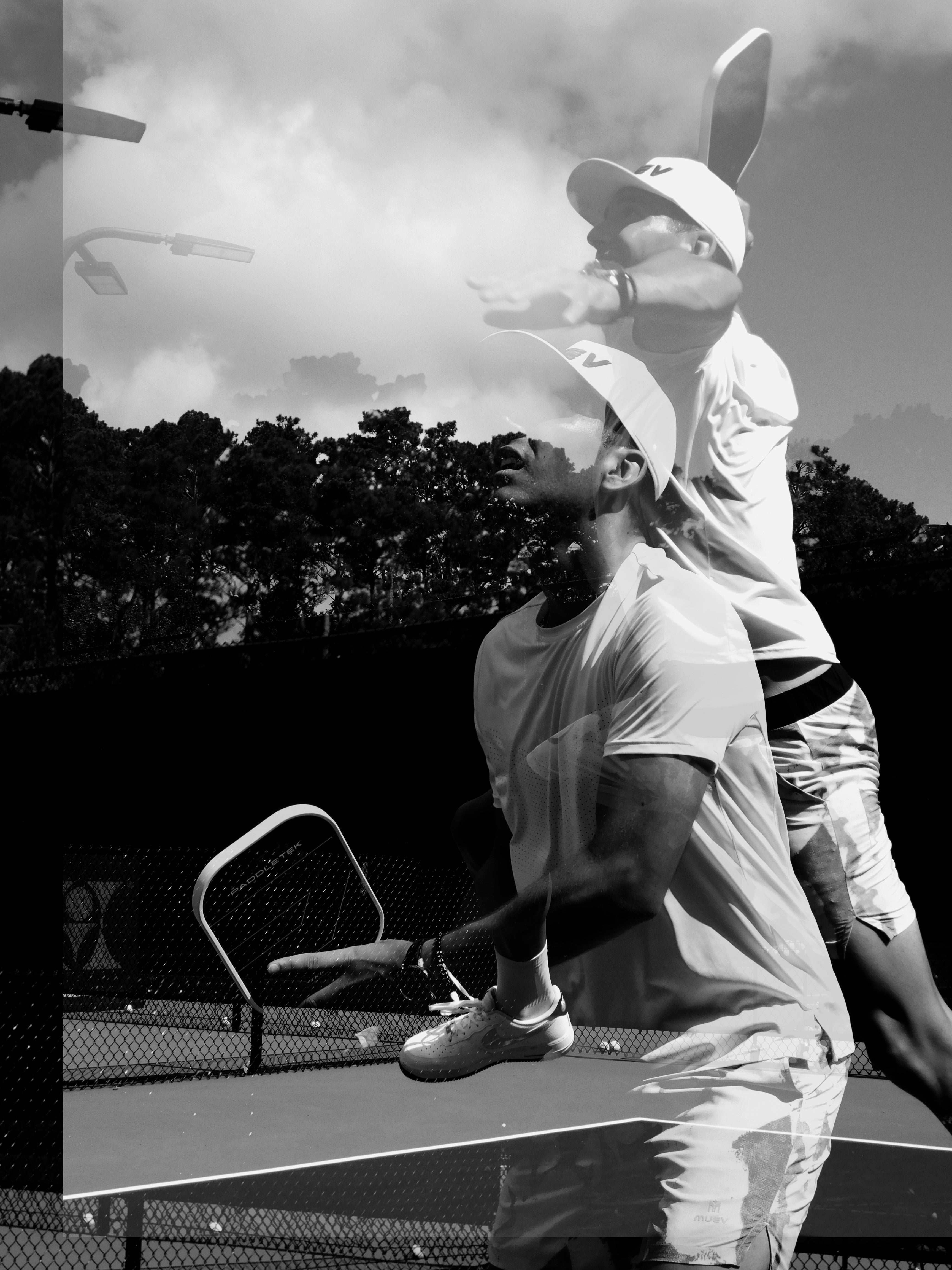 Man playing pickleball on court