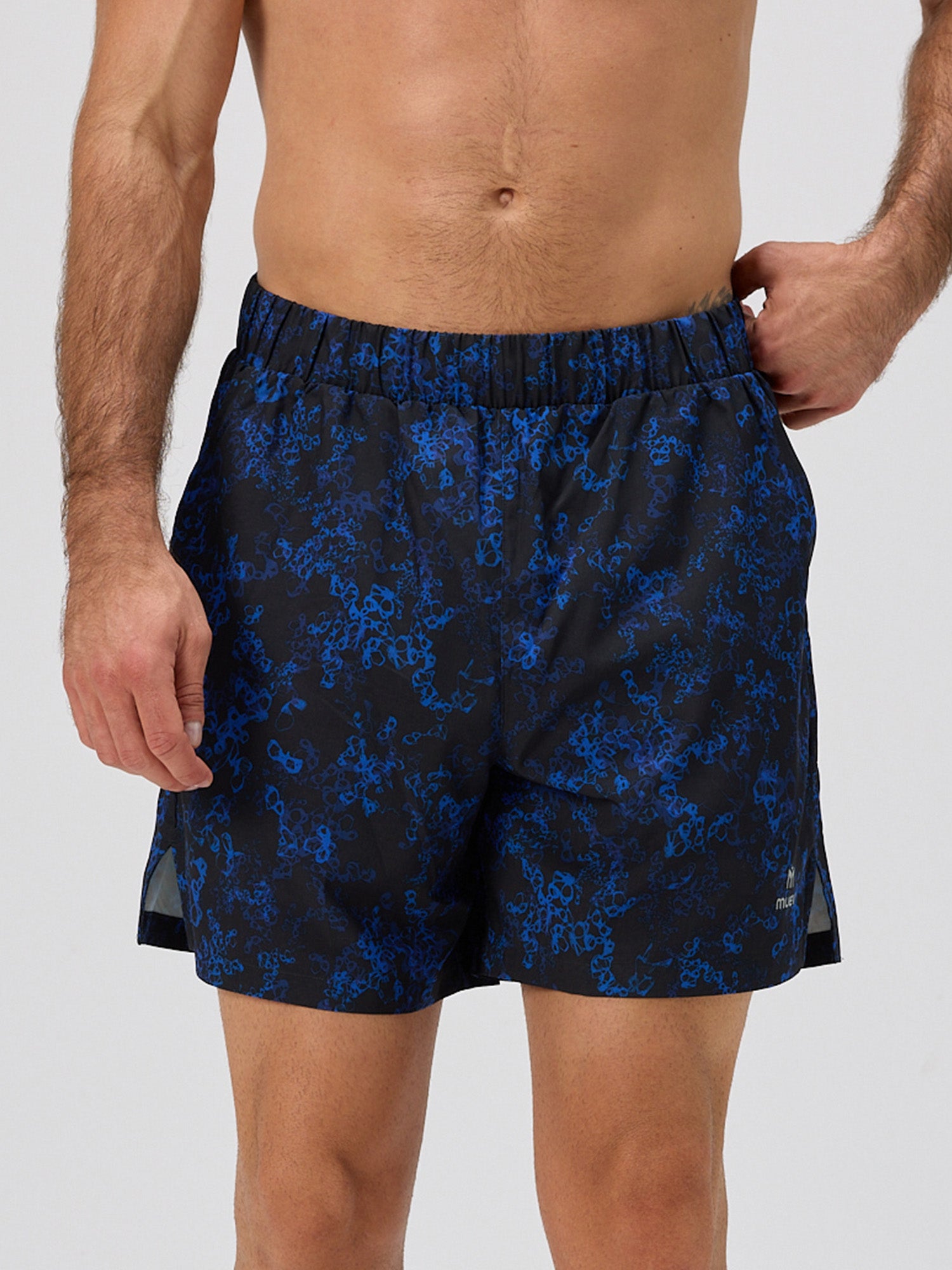 Front view of men's blue sakura patterned shorts with elastic waistband and premium stretch fabric, featuring a 6" inseam for padel and pickleball by MUEV