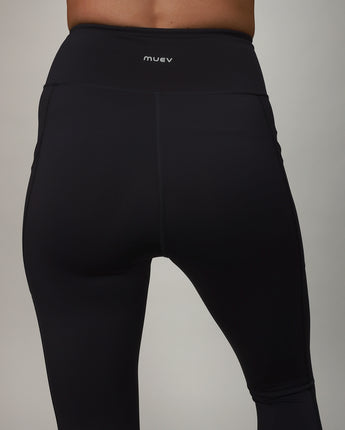 back of black leggings with crossover fabric at top 