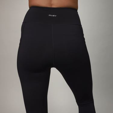 back of black leggings with crossover fabric at top 