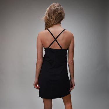 back of black tank dress with crisscross back straps