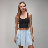 front of ice blue pleated skirt with black twist top 