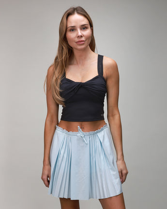 front of ice blue pleated skirt with black twist top 