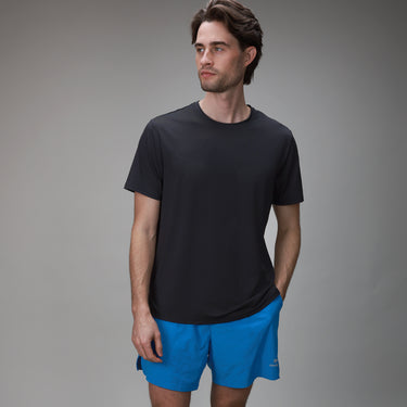 front of black chevron tee with blue short 
