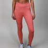 coral leggings with crossover fabric at top 