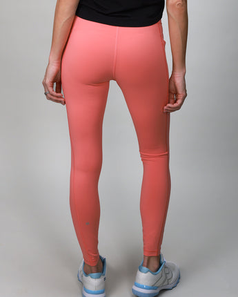 back of coral leggings with crossover fabric at top 