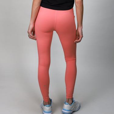 back of coral leggings with crossover fabric at top 
