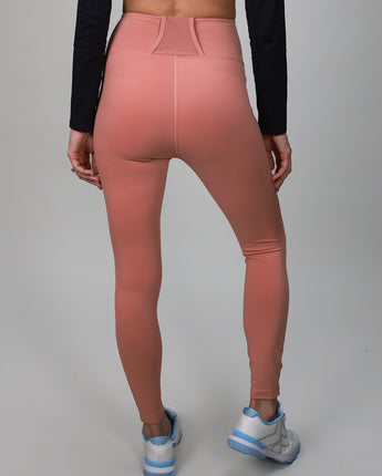 pink leggings with back strap and side pocket for ball 