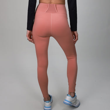pink leggings with back strap and side pocket for ball 