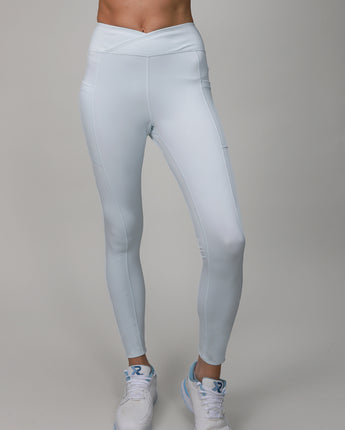 light blue leggings with crossover fabric at top 