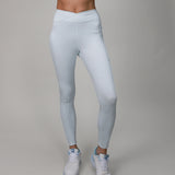 light blue leggings with crossover fabric at top 
