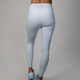 back of light blue leggings with crossover fabric at top 