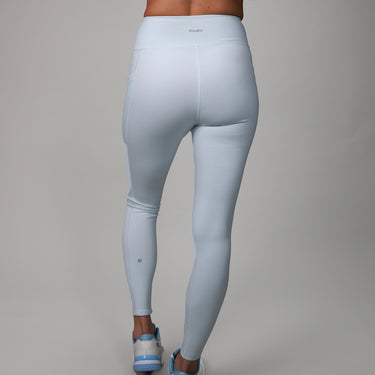 back of light blue leggings with crossover fabric at top 