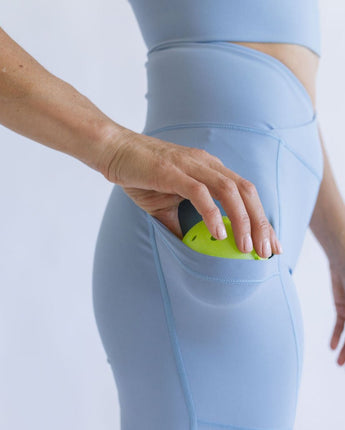 Pickleball going into pocket on side of leggings