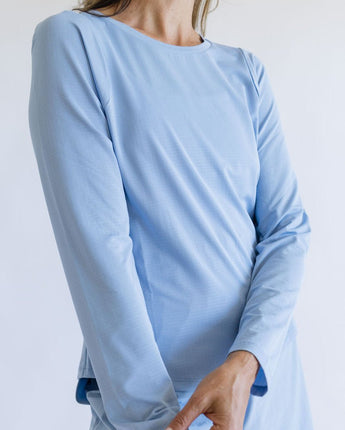 Blue long-sleeved shirt on a person