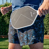 Blue and black Pickleball Base Line Shorts on a person