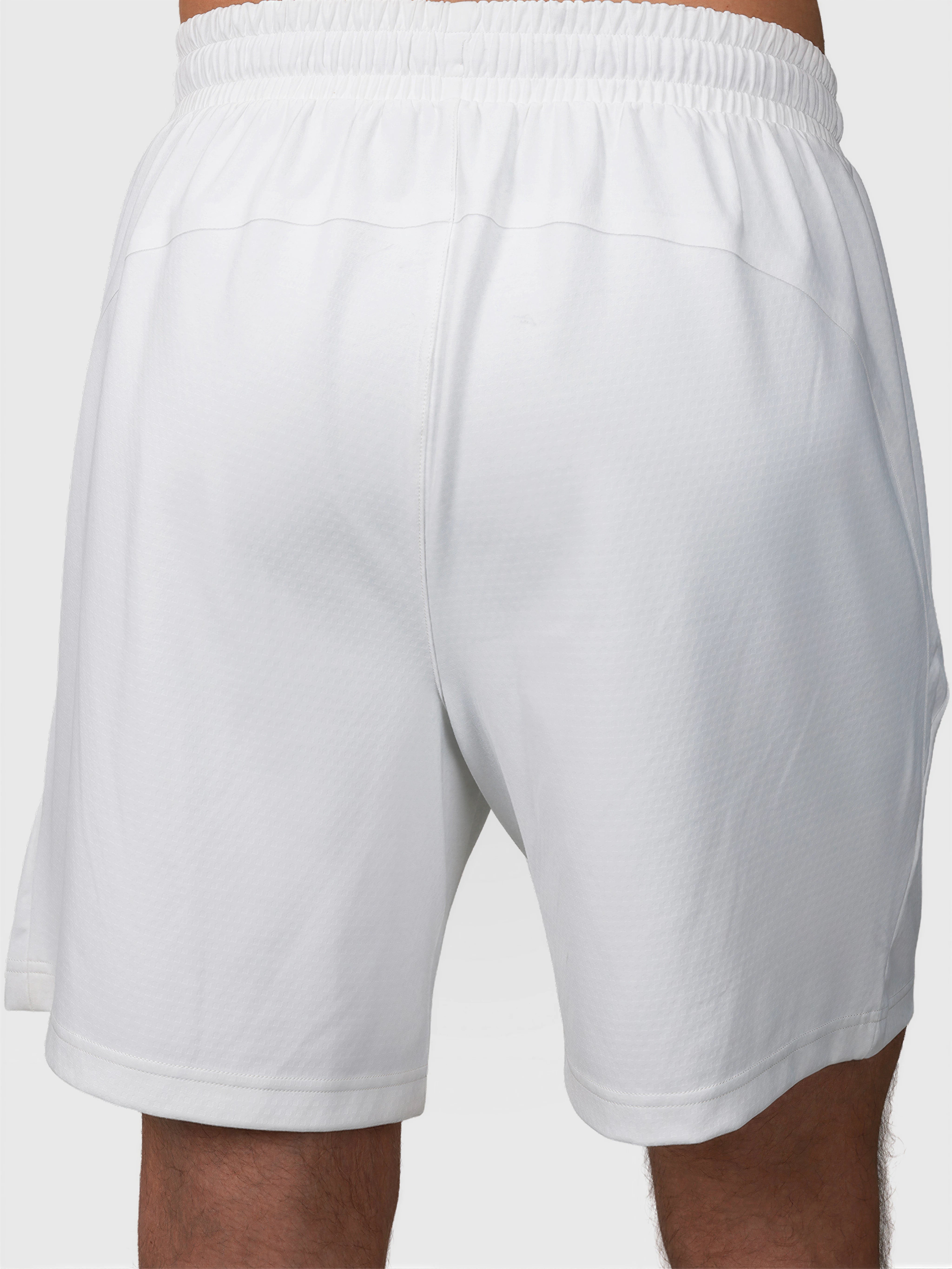 Back view of white Echelon Short by MUEV designed for padel and pickleball apparel with elastic waistband
