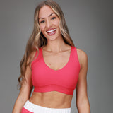 front of pink tanklette 