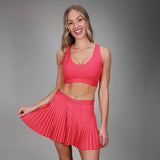pink pleated skirt with pink tanklette