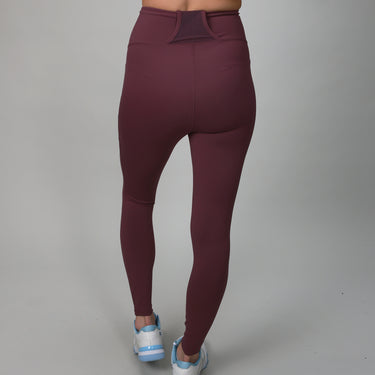 plum colored leggings with side and back pocket for ball 