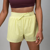 Yellow compression short with outer layer