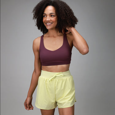front of yellow short and front of plum bra